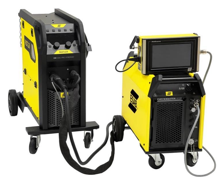 ESAB Checkmaster 600R resistive load bank on a wheel kit beside an ESAB Rustler welding power source, connected for calibration